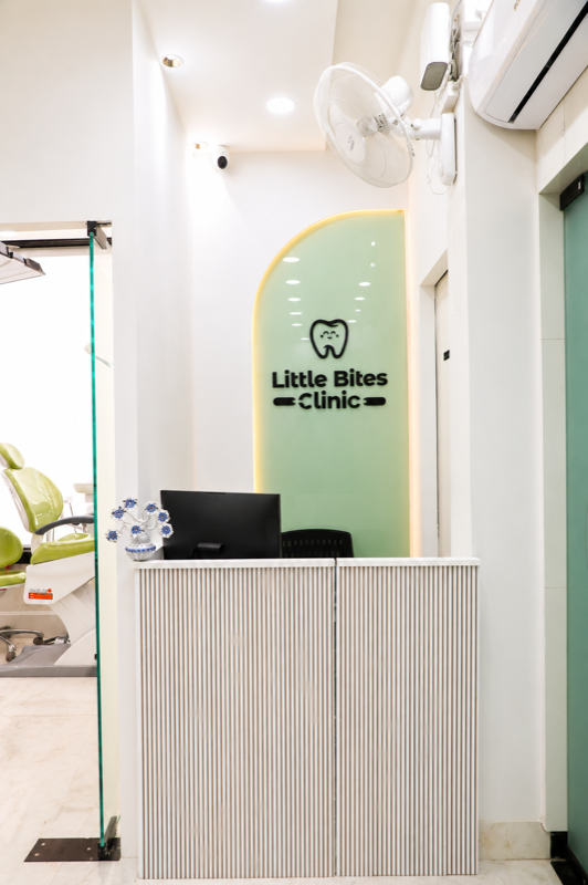 Reception desk with Little Bites Clinic branding