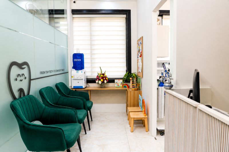 Comfortable waiting area with front desk and kids corner